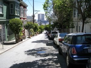 Car line a small street in San Francisco, a city that has a preference policy program.