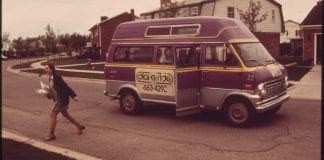 A passenger is dropped off by a dial-a-ride service in 1973.