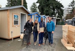 tiny houses in Tacoma, Wash., and volunteers who set them up