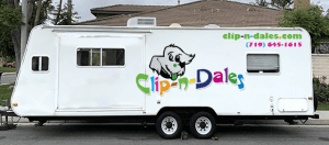 A white trailer that says Clip-n-Dales. The business is owned by a woman who was formerly incarcerated.