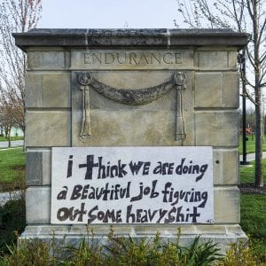 Eviction moratorium in the pandemic. Photo shows handpainted sign that says "I think we are doing a beautiful job figuring out some heavy shit"