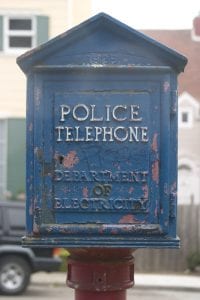 policing and segregation. Image of police telephone box, with peeling paint