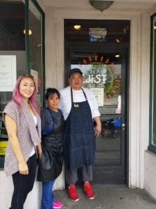 Little Tokyo Eats. Image shows JiST Cafe owners standing before their front door