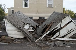 colonias. Stock image shows house collapsed from flood damage