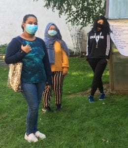 Asian community. Image shows three teenagers at an in-person event at SAYA