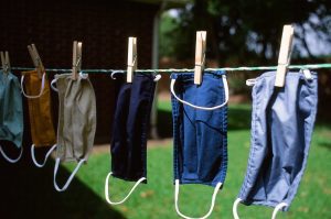 affordable housing asset management: photo shows COVID-19 masks drying on a clothesline