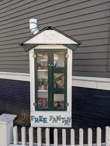 image shows a little free pantry, similar to a community fridge, in Somerville, Massachusetts