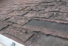 Close-up view of dilapidated asphalt roof shingles