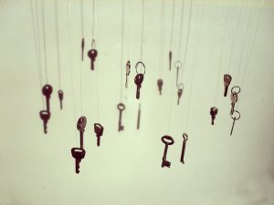 Keys, both vintage and modern, are suspended from thin wire to give a floating-in-air effect.