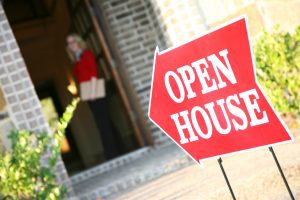 A realtor opening a house for viewing.