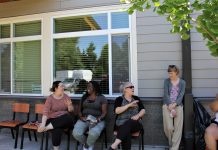 Residents at Lincoln Place gather and socialize outdoors.