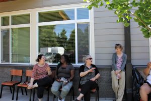 Residents at Lincoln Place gather and socialize outdoors.