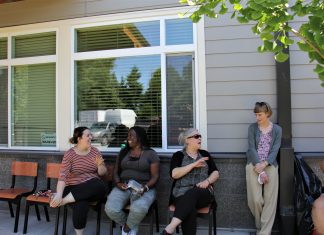 Residents at Lincoln Place gather and socialize outdoors.