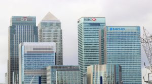 Several high-rise offices of banks in a city skyline. The photo is for an article about special purpose credit programs, which could help increase lending to Black and Brown communities long denied financial services.