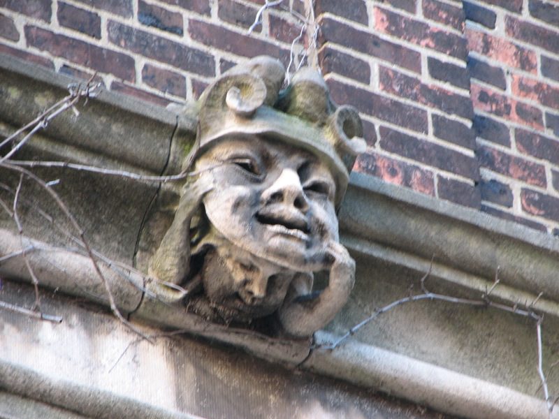 On the concrete trim of a brick building in Philadelphia, a carved grotesque of a masklike face looks out at the street. The view from just below reveals another face hiding behind it, representing, for this article, hidden land ownership.