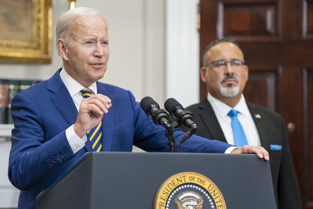 U.S. President Joe Biden speaks at a White House podium.