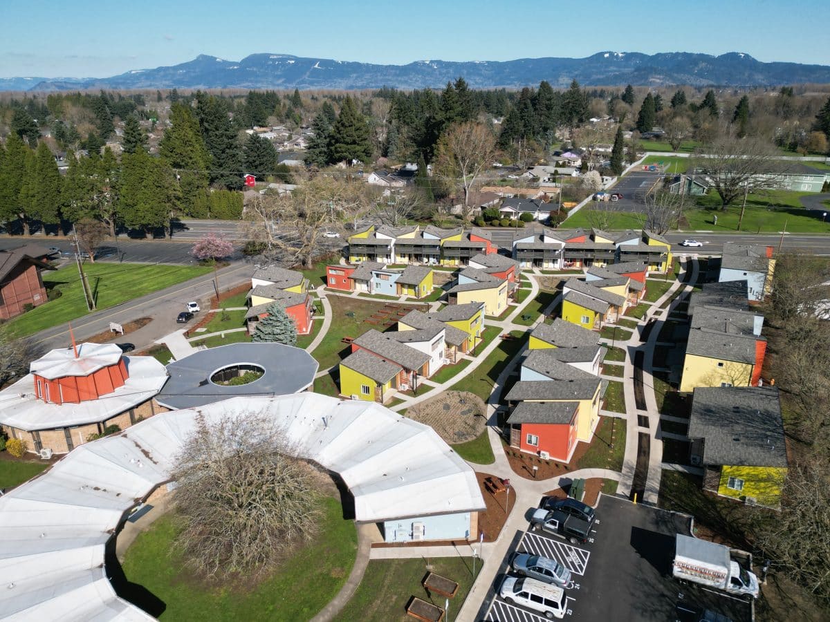 aerial photo of a group of small, colorful homes