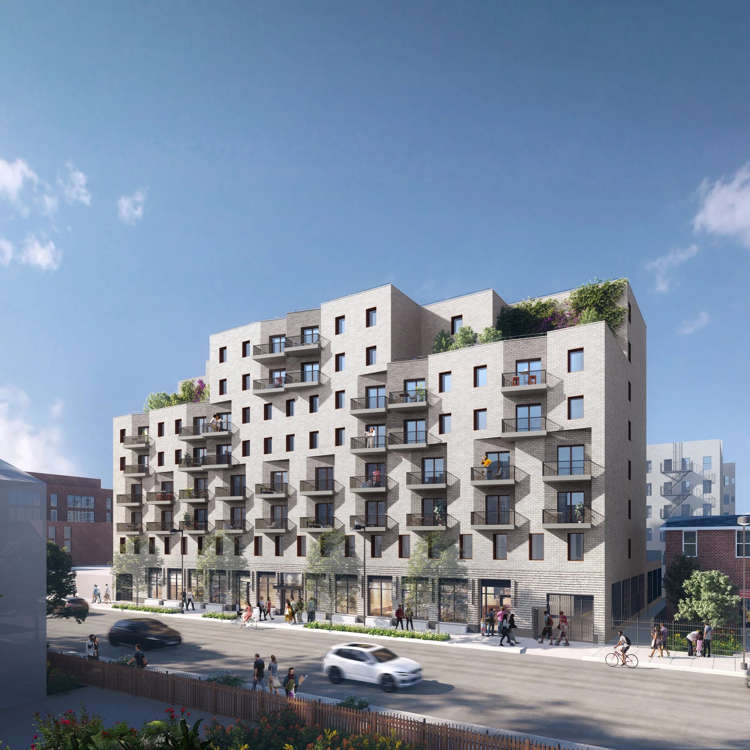 An architectural rendering of a large multifamily building